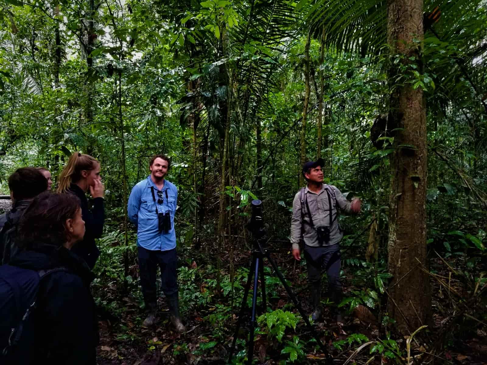 Tour Guide Jordy teaches travelers about the jungle